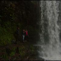 behind the waterfall